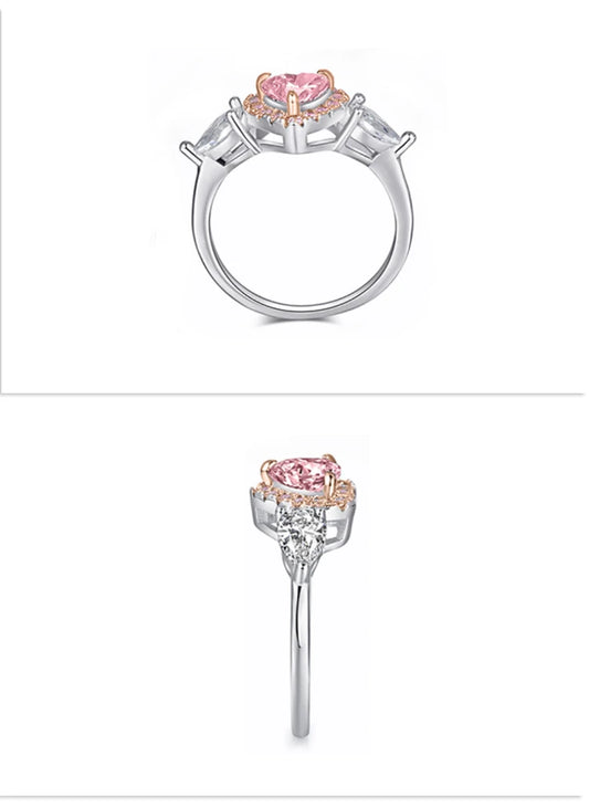 Silver ring with pink gemstone on a white background